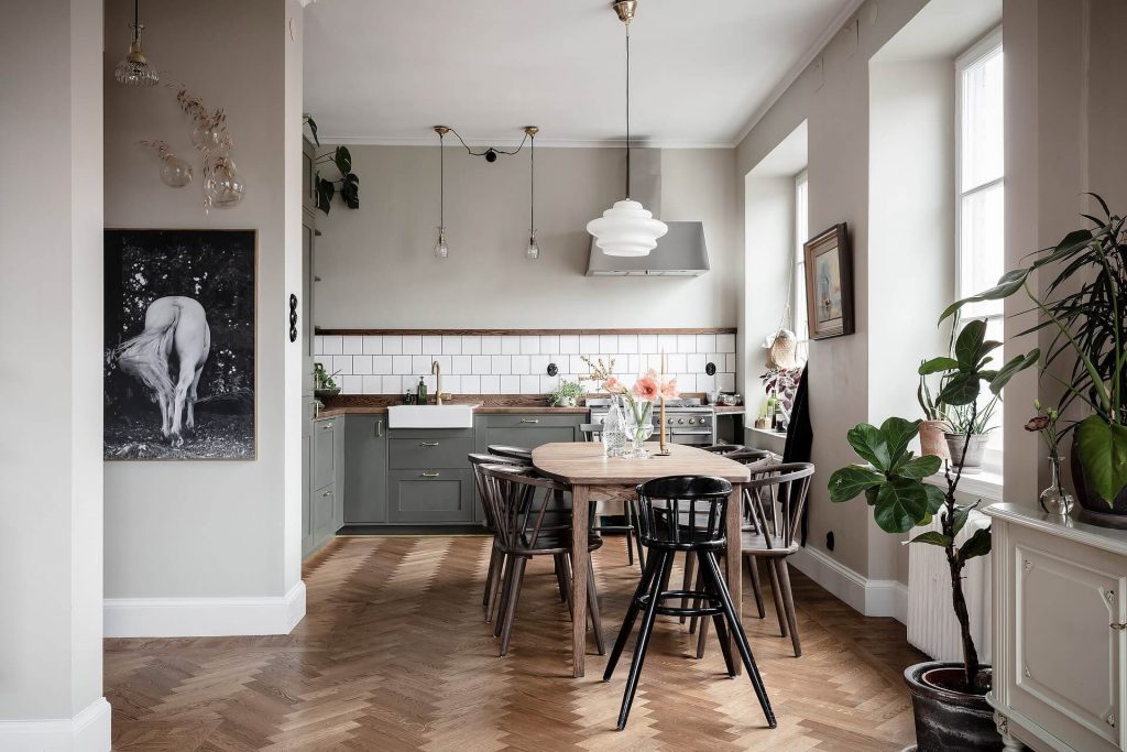 Kitchen open to Scandinavian style dining room